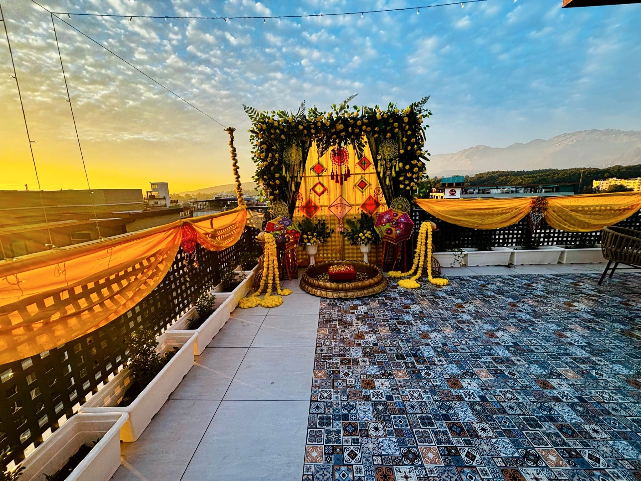 A rooftop terrace at one of the properties running ZimmerStack, decorated for an evening event